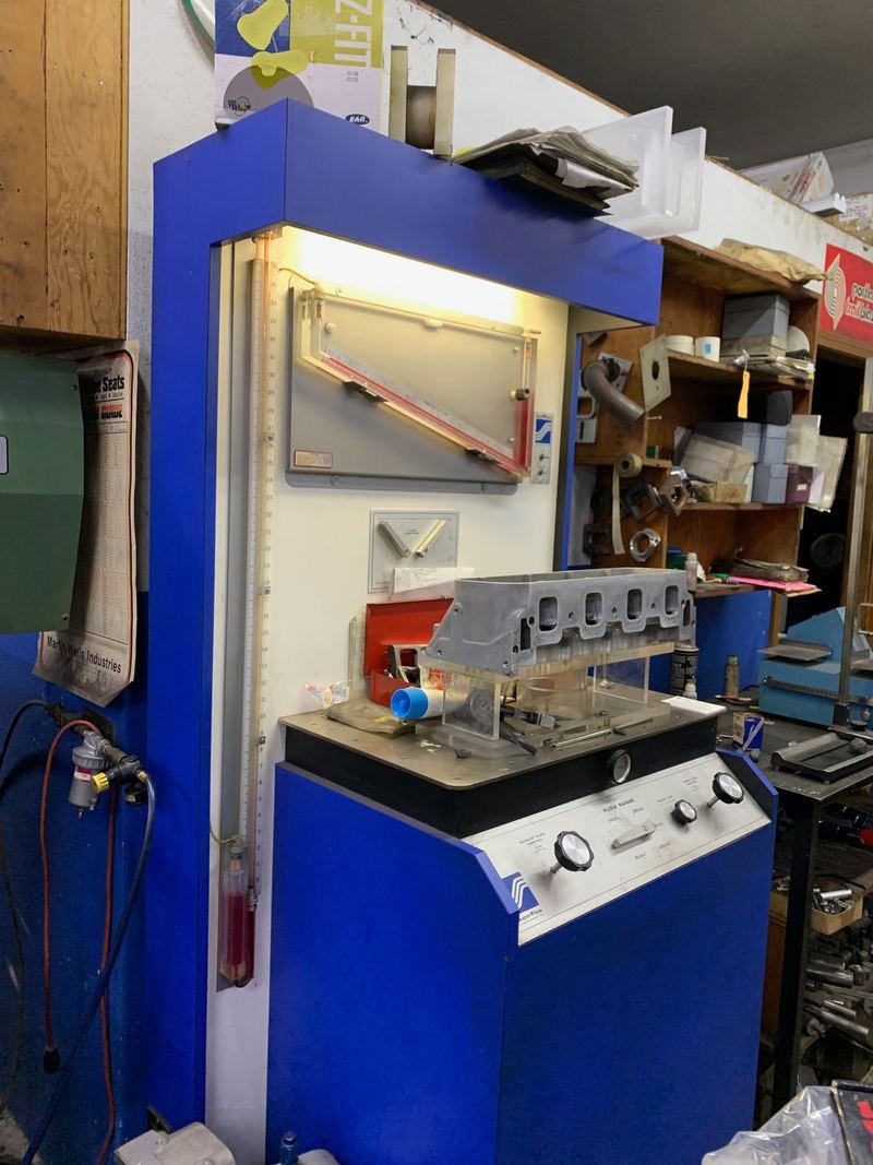 Blue test stand and control console inside the Lindvig Machine shop
