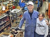 Two people standing in the Lindvig Machine shop